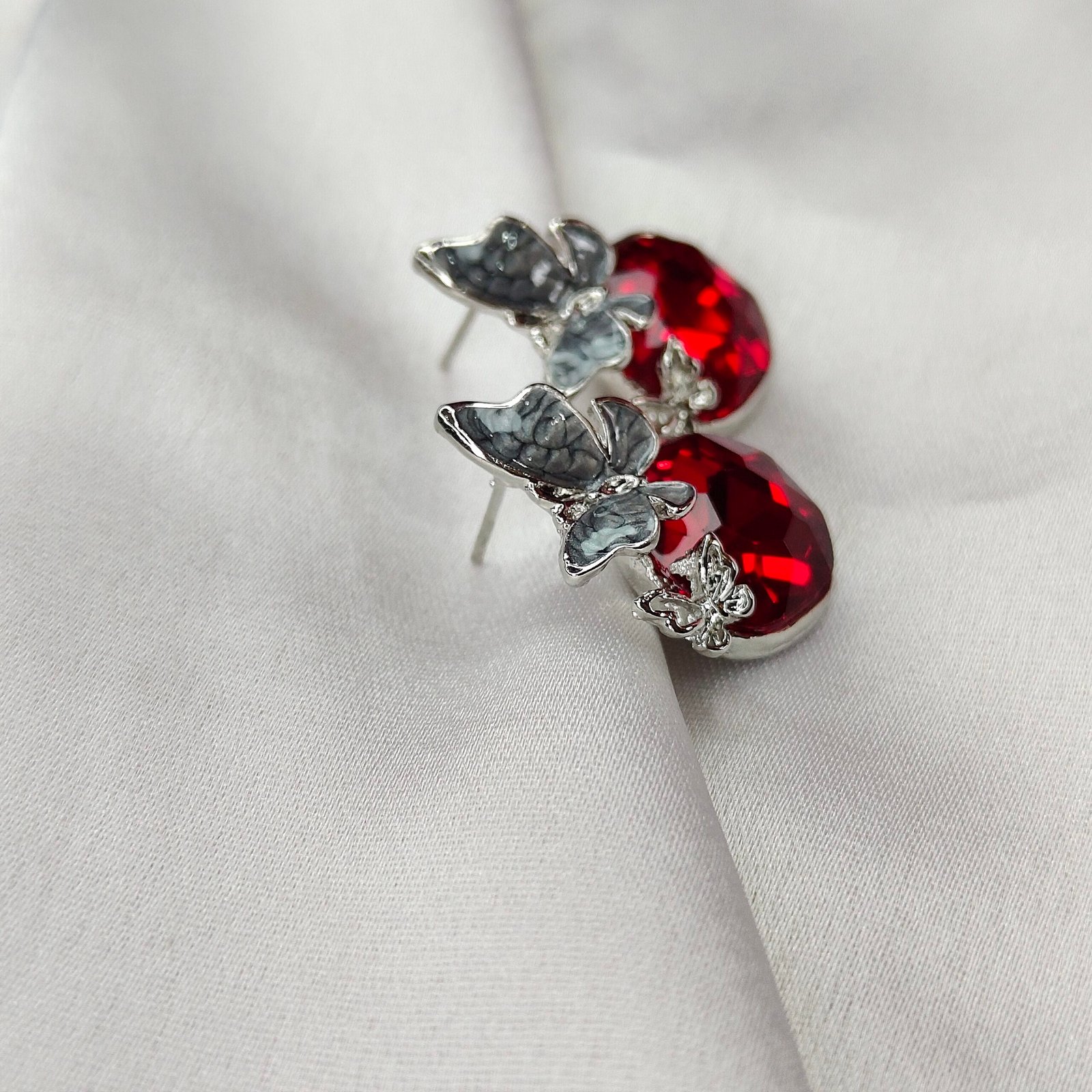 Jevaya Ruby Red Butterfly Stud Earrings with Silver Accents - Image 3