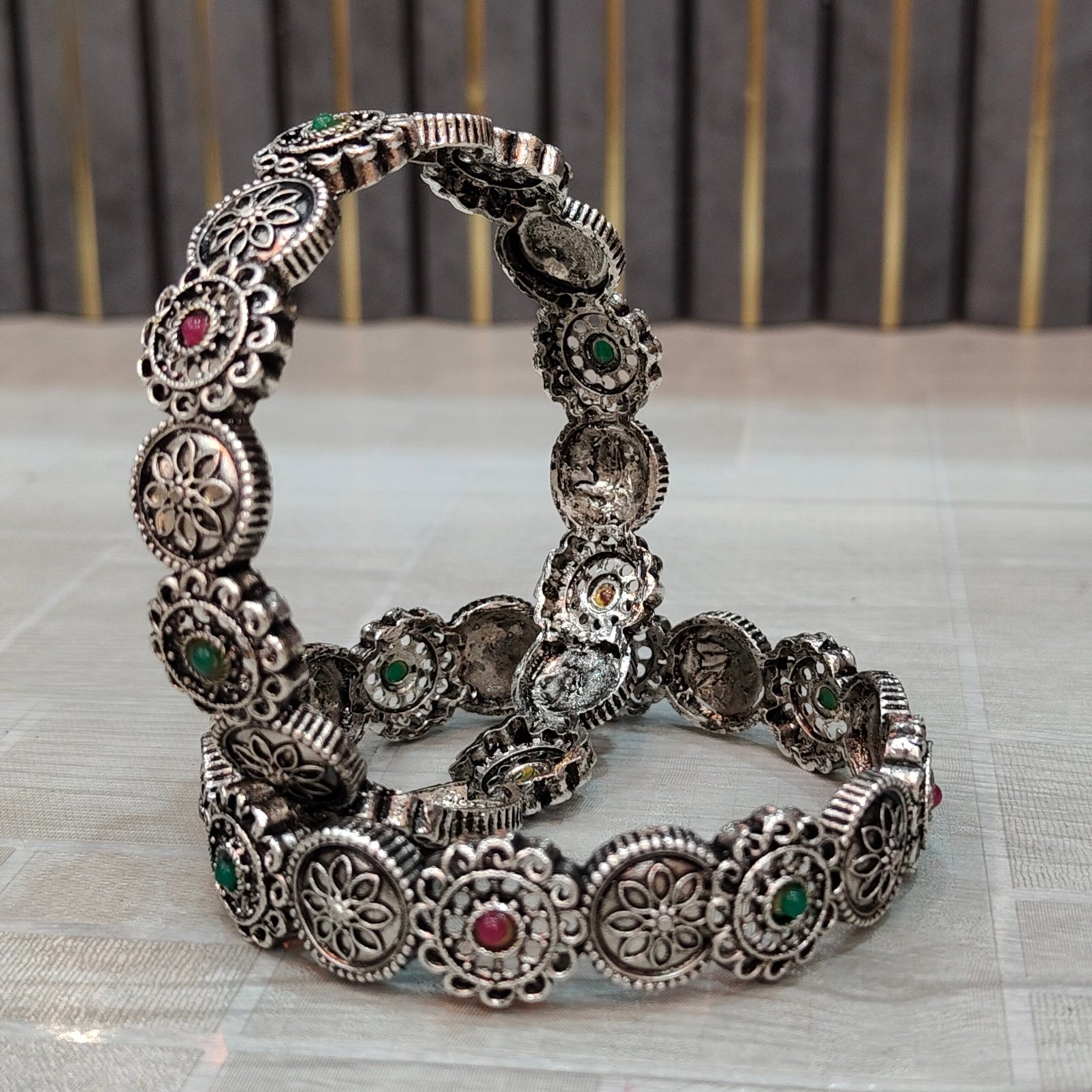 Antique Oxidized Silver Floral Round Motif Bangles with Red & Green Stone Accents - Image 4